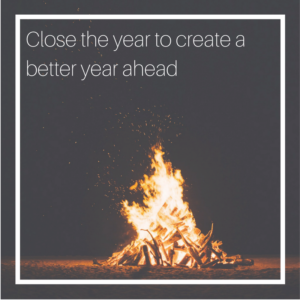 Image of a bonfire at night with the caption: close the year to create a better year ahead.